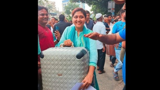 Amid chaos at Sheikh Hasina's residence, woman smiles with a Dior suitcase. See viral pic